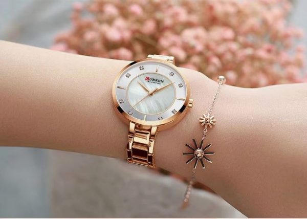 CURREN 9051 Women's Quartz Dress Watch - Golden White Rose-gold watch worn on a wrist