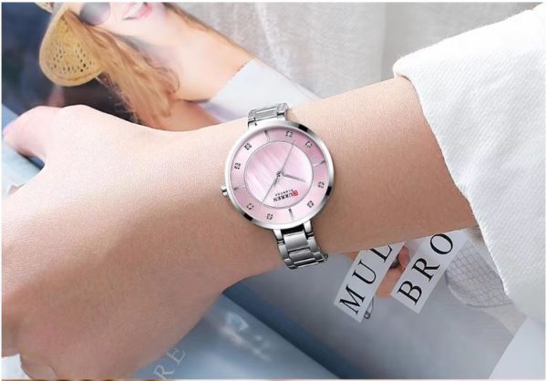 CURREN 9051 Women's Quartz Dress Watch - Golden White Pink-face silver watch worn on a wrist